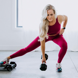 woman doing side lunge with heroboard